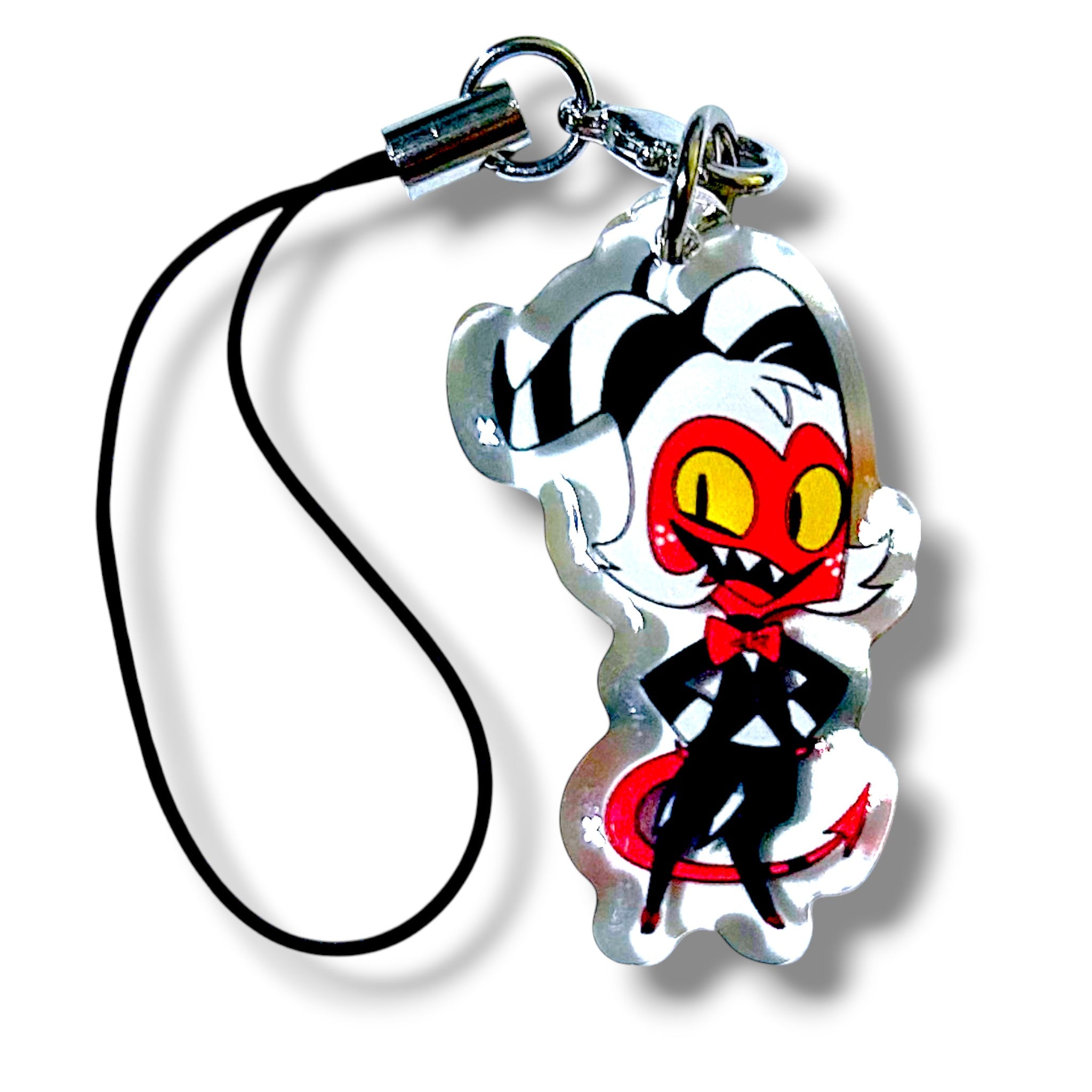 Stylized acrylic keychain charm featuring a cartoon character with a red face, yellow eyes, sharp teeth, and white hair with black stripes. The character wears a black suit with a red bow tie and stands confidently with hands on hips. The charm is attached to a black strap with a silver clasp, showcasing a bold and mischievous design ideal for fans of animated assassin themes.