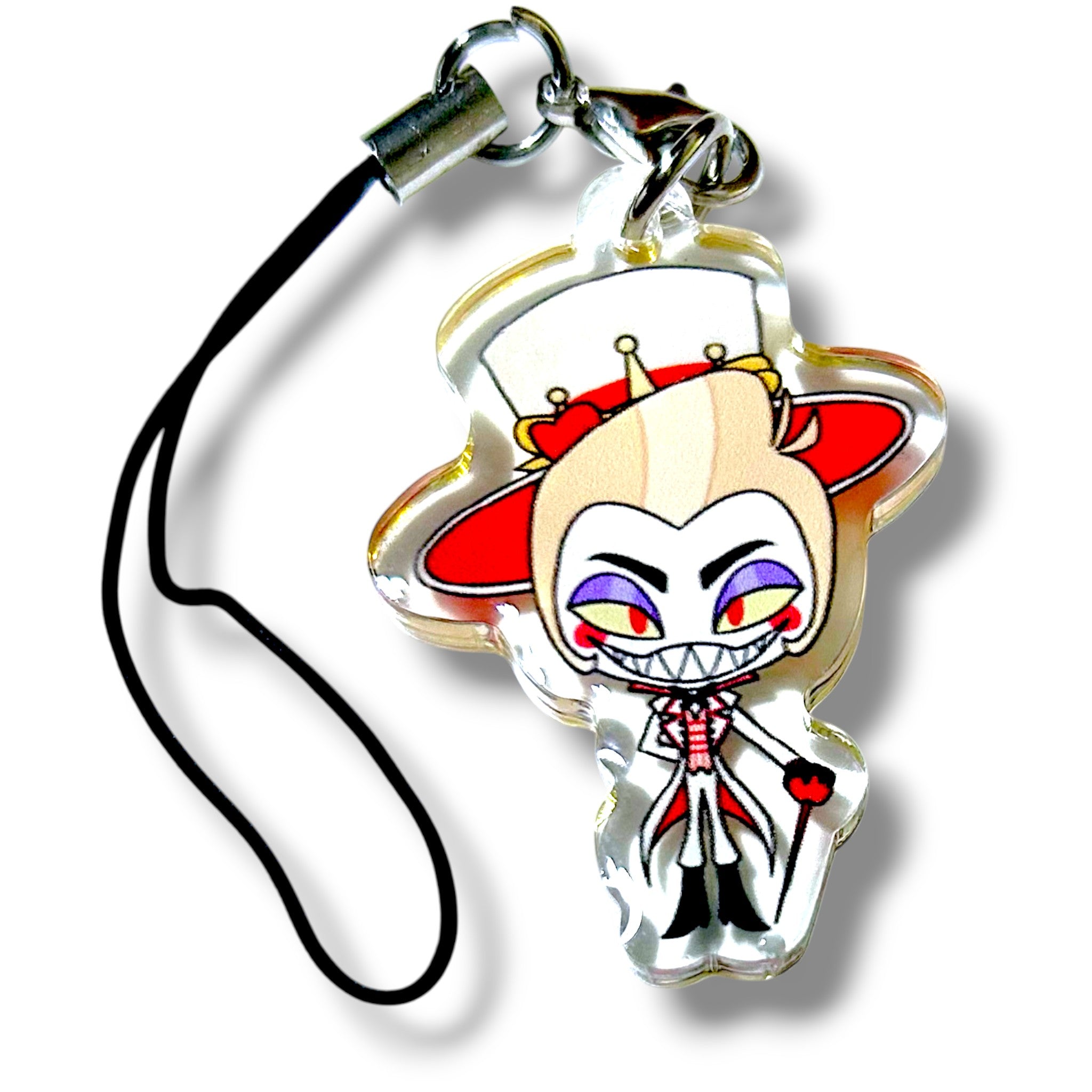 Acrylic keychain charm featuring a cartoon demon king character with a mischievous grin, sharp teeth, and purple eyeshadow. The character wears a tall white top hat with red trim and small red and yellow decorations, along with a white outfit accented in red. It holds a red-tipped cane and stands confidently. The charm is attached to a black strap with a silver clasp, making it a bold and collectible accessory for fans of theatrical villains and stylized merch.