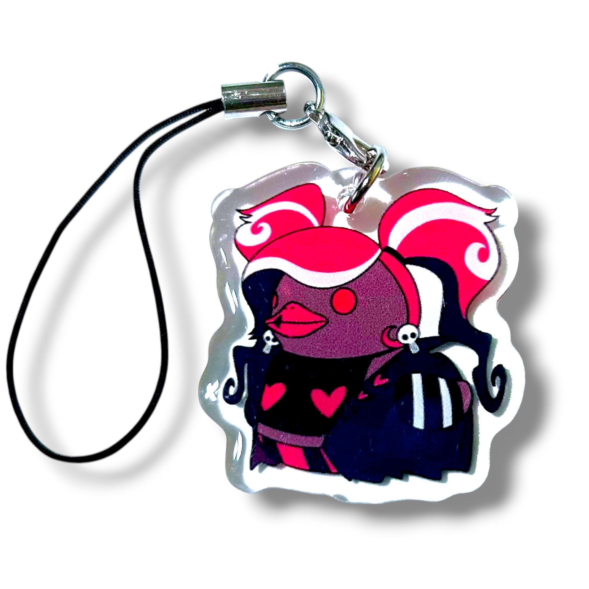 Acrylic keychain charm featuring a stylized cartoon character with voluminous pink-and-white curls, dark purple and pink color scheme, and heart motifs on the chest and cheeks. The character wears skull accessories in the hair and outfit, giving it a gothic and playful vibe. The charm is attached to a black strap with a silver clasp, ideal for fans of bold, alternative aesthetics and expressive character designs.