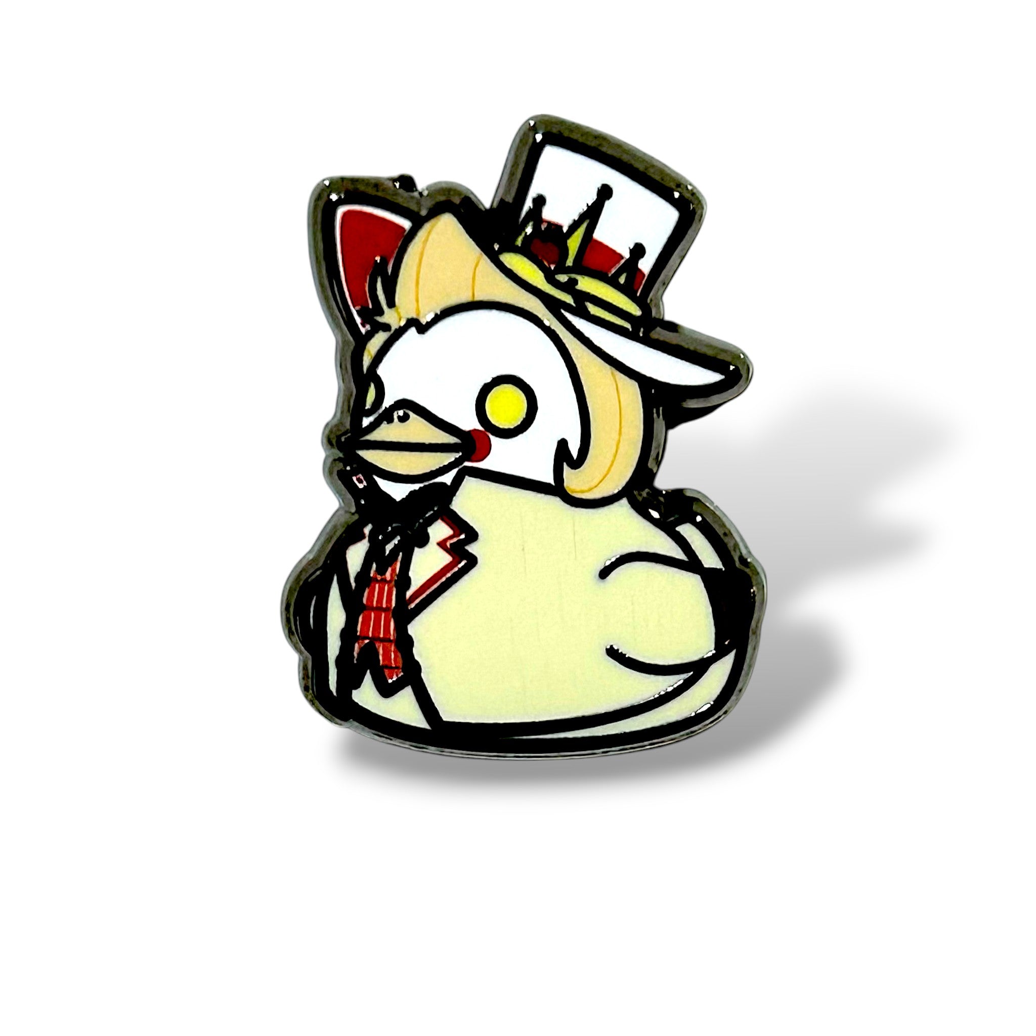 Cartoon-style enamel pin of a white duck character wearing a formal white suit jacket with black trim, a red checkered necktie, and a tall white top hat decorated with red and yellow accents. The duck has a yellow beak, a red cheek mark, and a tuft of yellow hair, giving it a regal and playful appearance. The design is outlined in black with a glossy finish, capturing a whimsical “demon king” aesthetic in mini duck form.