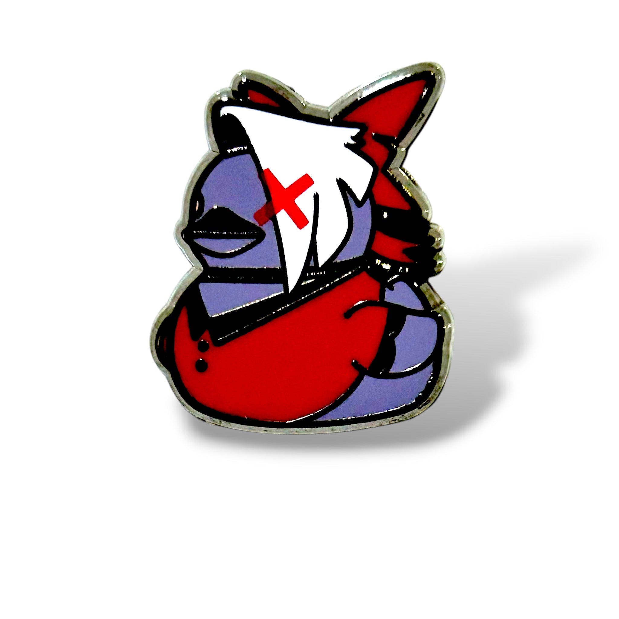 Cartoon-style enamel pin of the duck has a purple body, a red outfit, and a white hair-like feature with a bold red “X” mark over one eye. A red bow sits on its head, and the design is outlined in black with a glossy enamel finish. The playful yet fierce look captures Vaggie’s determined personality in a whimsical