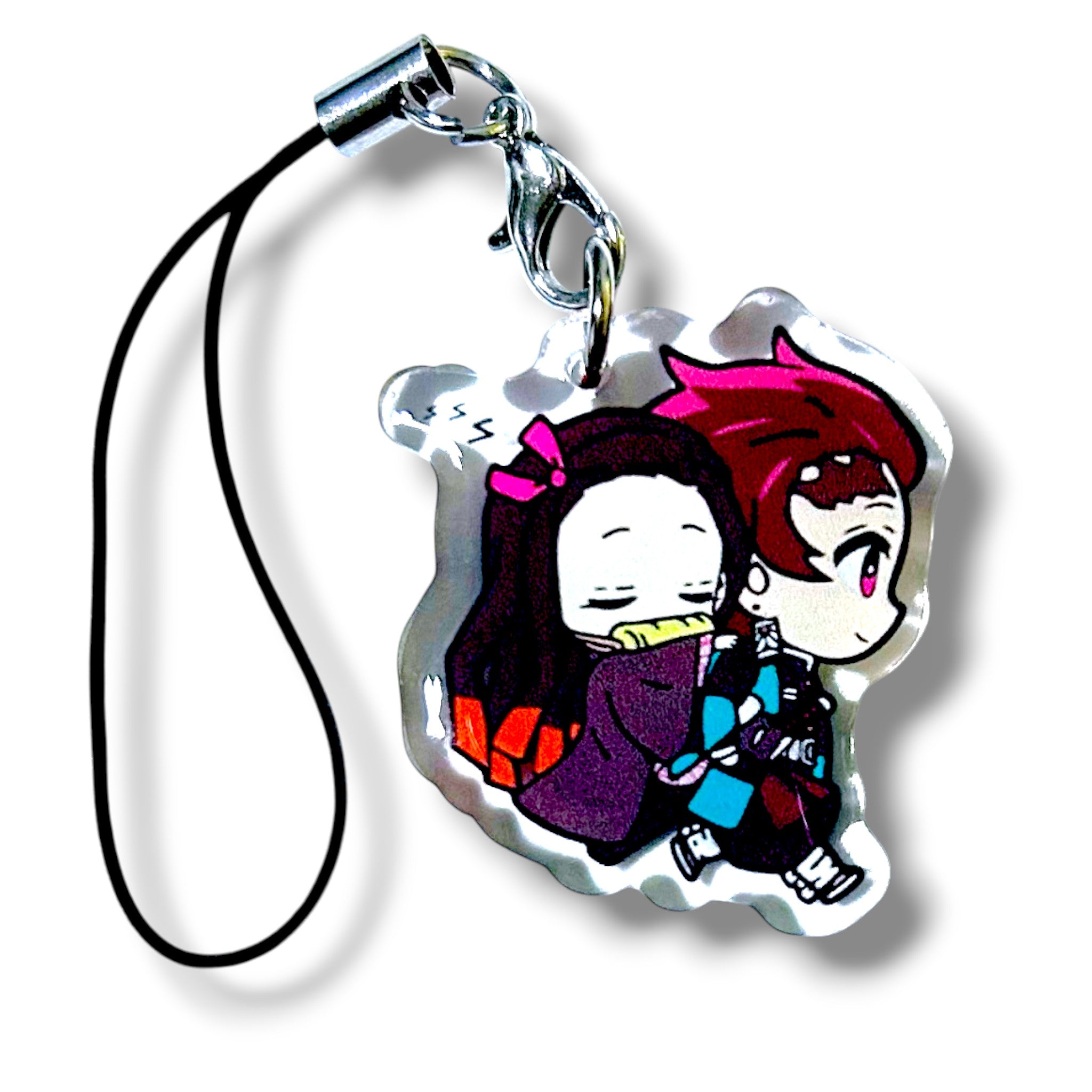 Cartoon-style acrylic keychain charm featuring two chibi siblings. One character is shown sleeping while being carried by the other, who has a gentle expression and wears a checkered outfit. The design is colorful and expressive, with exaggerated features typical of chibi art. The charm is attached to a black strap with a silver clasp, making it a collectible accessory for anime fans.