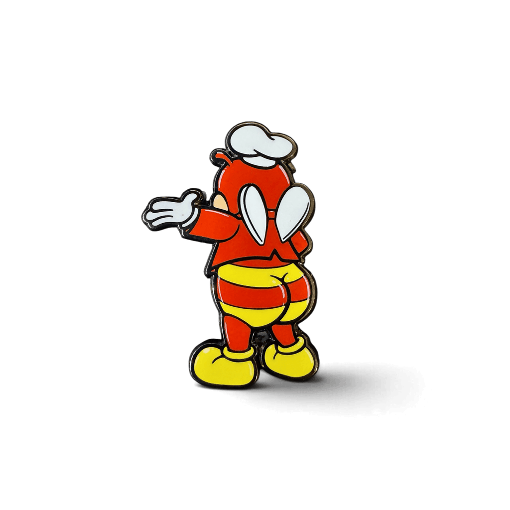 A cartoon-style Jolli-Butt enamel pin featuring a red character in a white chef’s hat, striped pants, and yellow shoes, shown from the back on a white background.