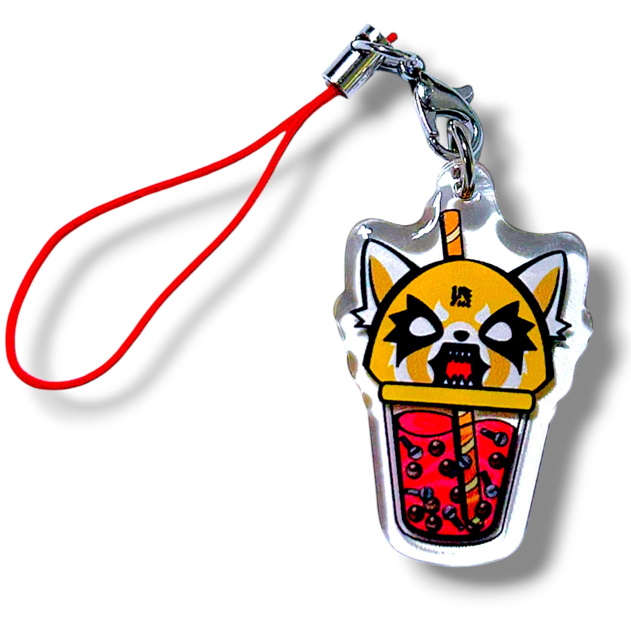 Kawaii-style phone charm featuring an angry red panda character inside a bubble tea cup. The red panda has wide eyes, sharp teeth, and a furrowed brow, with a red Chinese character (怒) meaning “anger” on its forehead. The cup includes visible tapioca pearls and a red straw, blending cute and fierce elements in a playful, expressive design. Attached to a red strap with a metal clasp, this charm is perfect for fans of animated characters and boba-themed accessories.