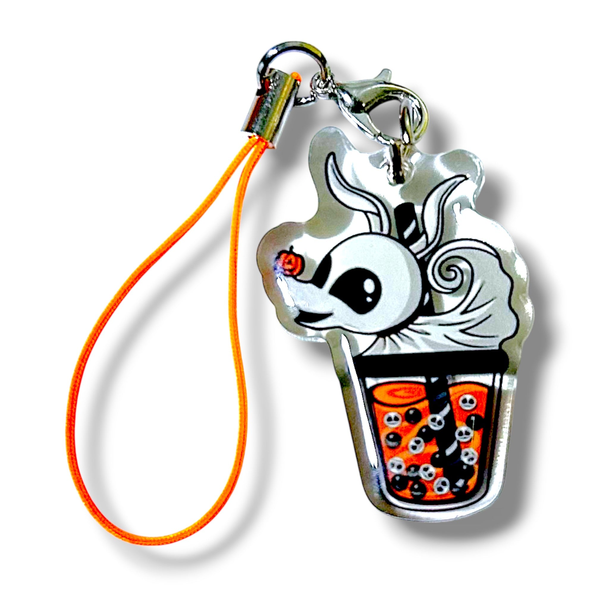 Cartoon-style keychain charm featuring a white rabbit emerging from an orange bubble teacup. The rabbit has large eyes, long ears, and a small orange rose on its head. Inside the cup are black and white tapioca pearls with skull faces, adding a spooky-cute Halloween vibe. The charm is made of clear acrylic and attached to an orange strap with a metal clasp. The design blends eerie and adorable elements, making it a unique and collectible accessory.