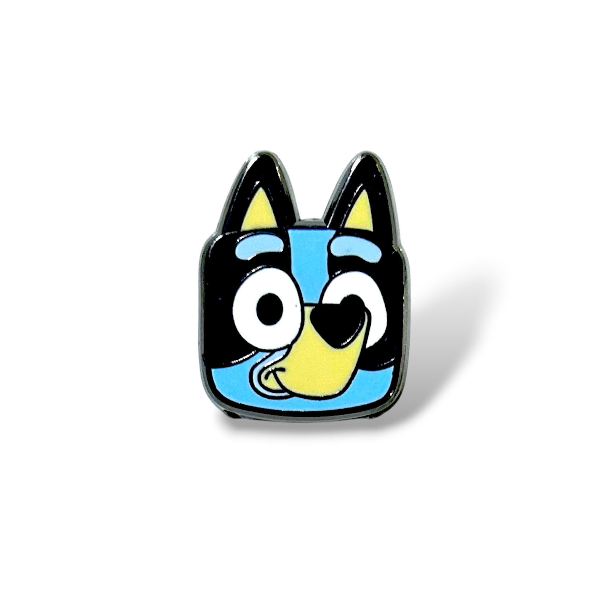 Cartoon-style enamel pin featuring a smiling blue dog character with black and yellow accents, large expressive eyes, and a cheerful expression; designed with bold lines and vibrant colors in a playful, simplified style.