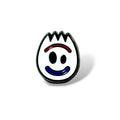 Cartoon-style enamel pin featuring a white spork face with black oval eyes, a red curved eyebrow line, and a blue smiling mouth; outlined in black with a jagged top edge, designed in a playful, simplified style.
