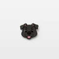 Cartoon-style gray dog face pin with floppy ears, big round eyes, and tongue sticking out, designed in anime-inspired style – cute enamel accessory for pet lovers and anime fans.