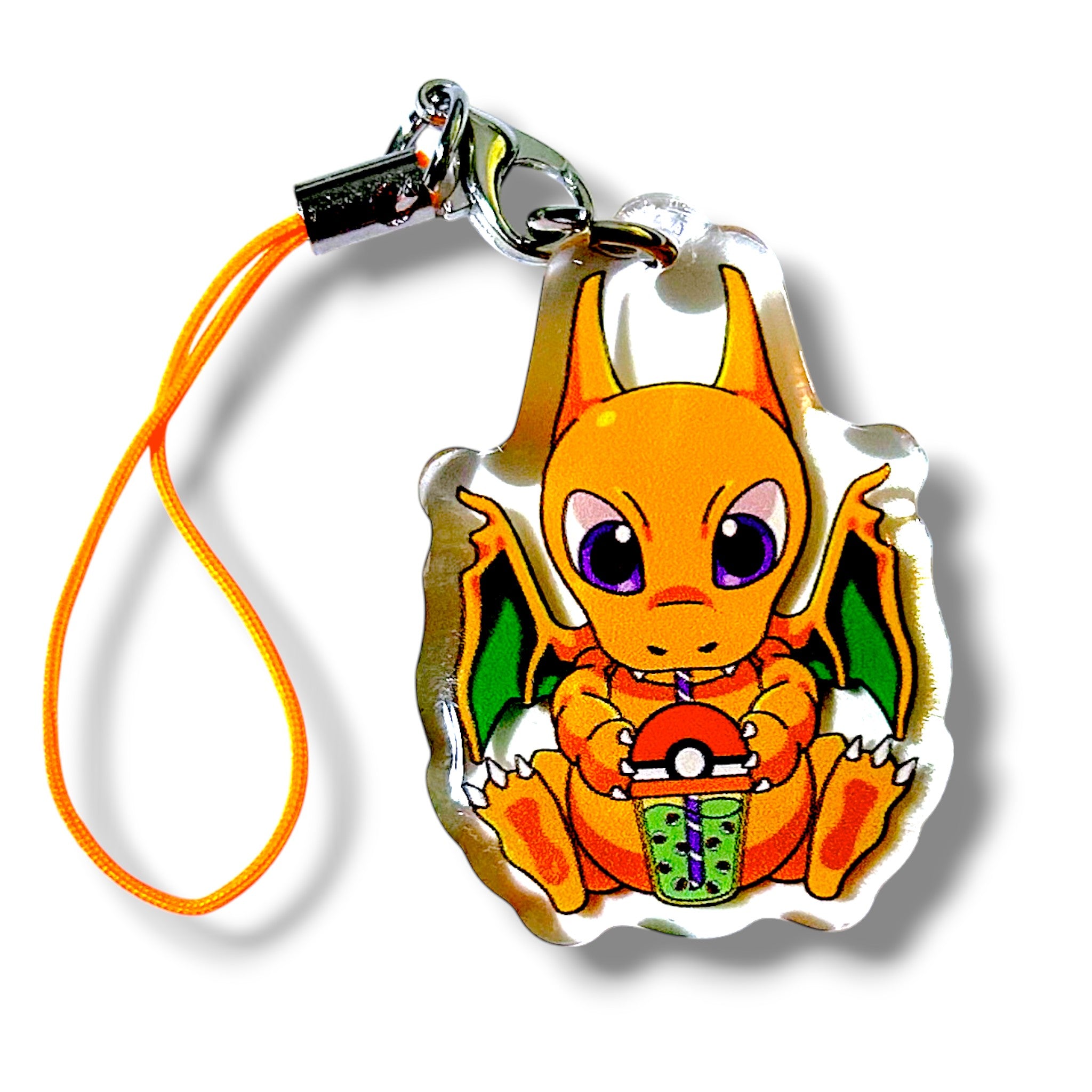 Acrylic keychain charm featuring a chibi-style fire dragon character with large purple eyes and a small body. The dragon holds a green bubble tea drink with purple boba. The charm includes an orange strap and silver clasp, making it a playful and collectible accessory for fans of pocket creature designs and boba-themed merch.