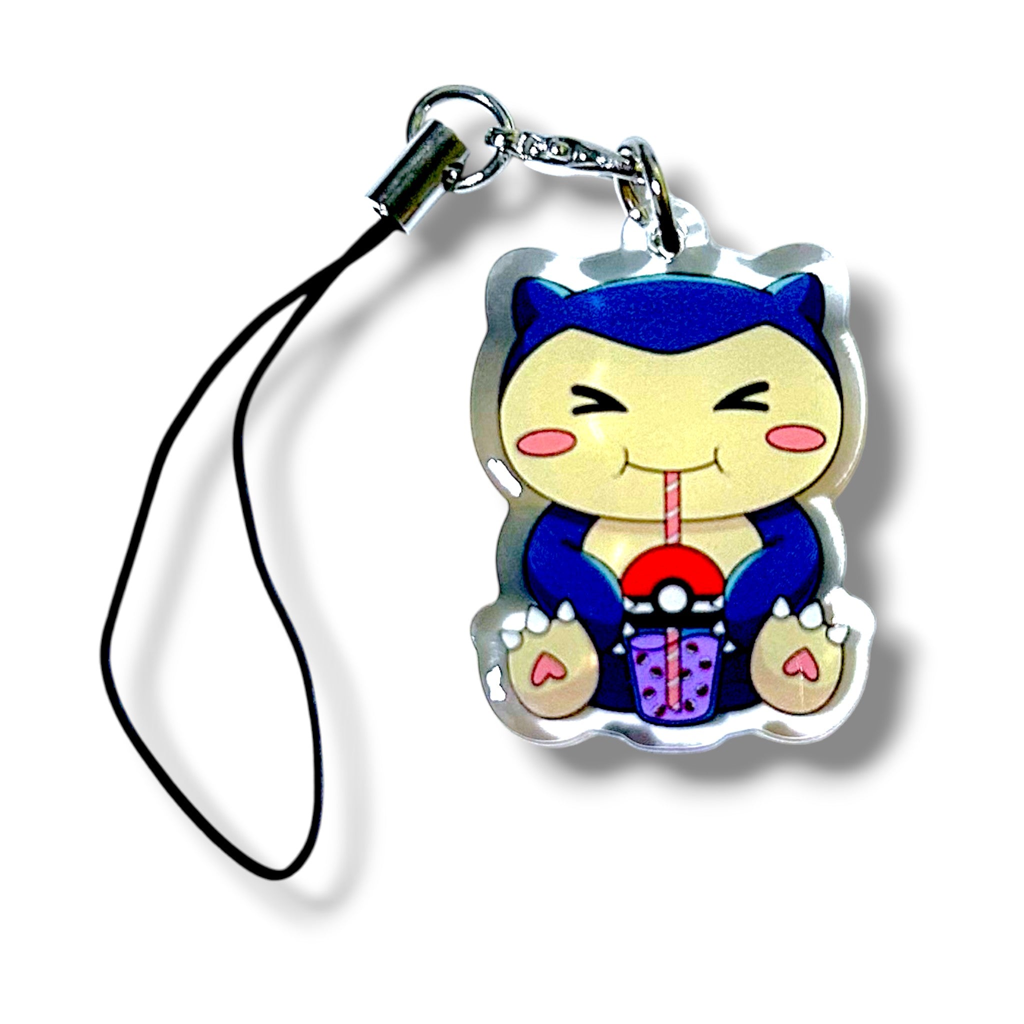 Cartoon-style keychain charm featuring a round blue and cream-colored character with a smiling face and closed eyes. This cute creature is holding a bubble teacup. The charm has a metallic outline and is attached to a black strap with a silver clasp. The design combines cozy vibes with playful boba tea aesthetics, making it a fun and collectible accessory