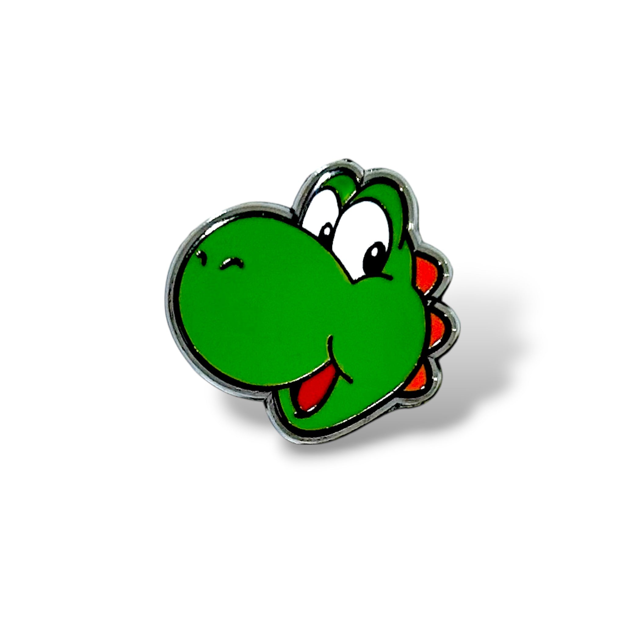 Enamel pin featuring a cartoon-style green dinosaur head with a rounded snout, big white eyes, orange spikes along the back, and an open smiling mouth with a red tongue; outlined in black with a glossy finish for a playful, gaming-inspired look.