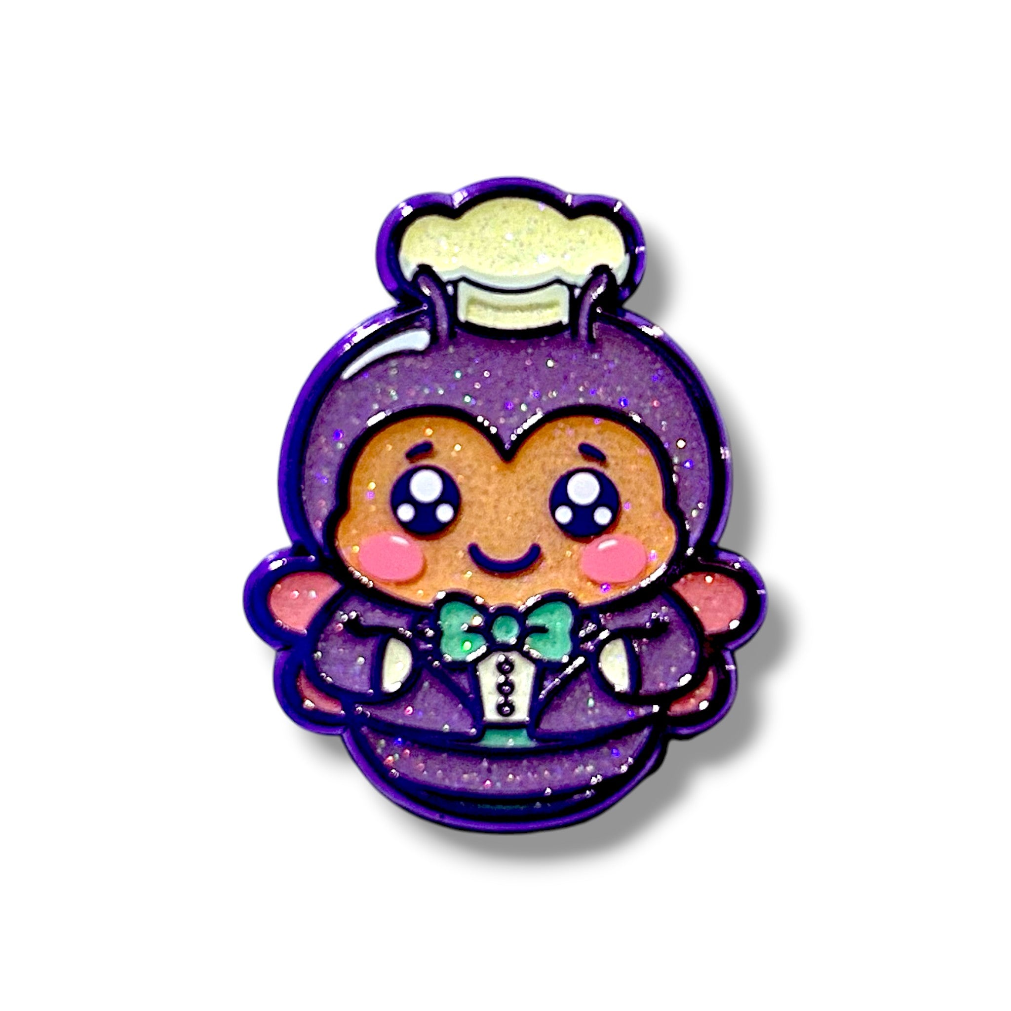 Glittery cartoon bee character with large shiny eyes, pink cheeks, and a cheerful smile, wearing a purple outfit with a green bow tie, white buttons, wings, and a white chef’s hat.