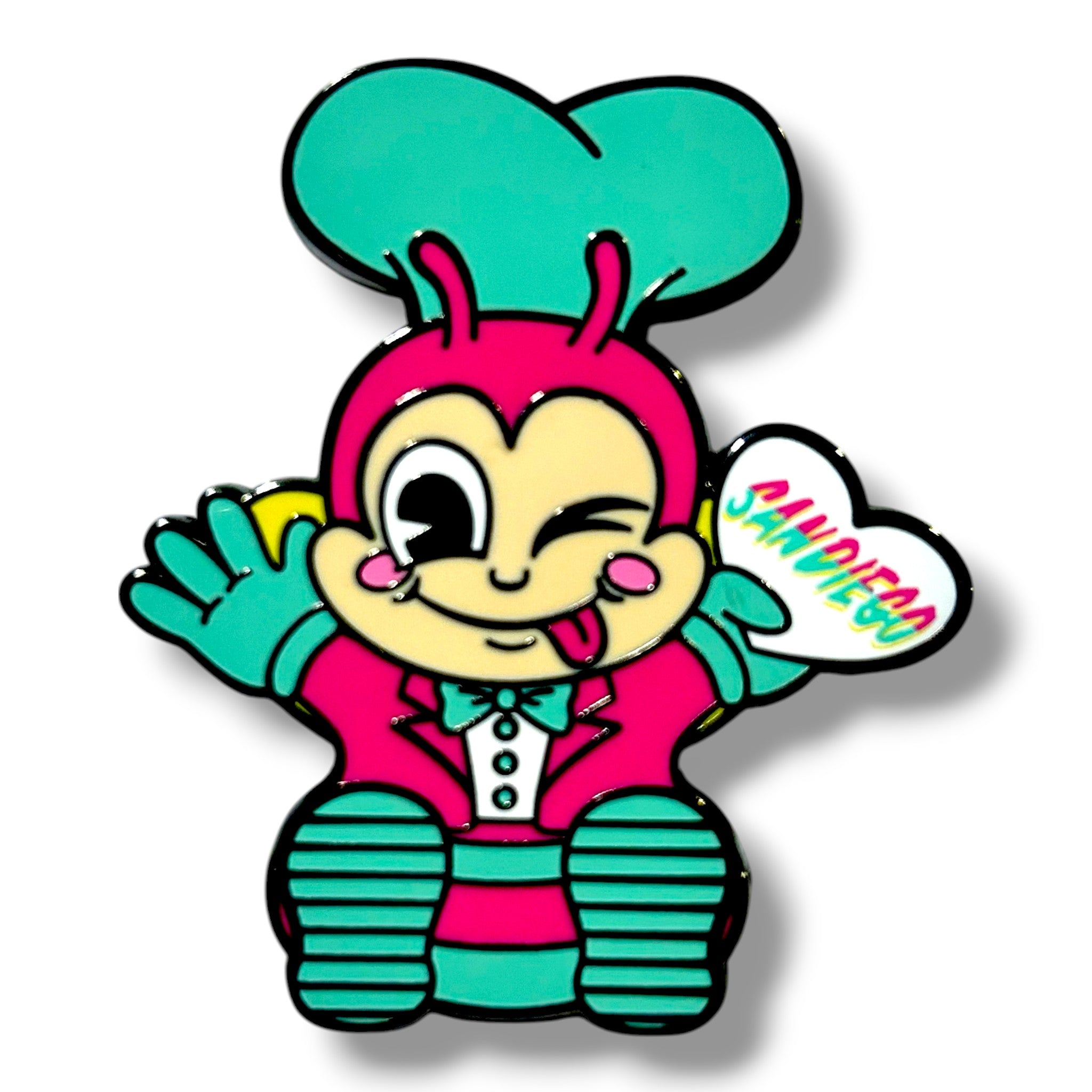 Cartoon chef character with a teal hat and pink suit, winking and sticking out its tongue, holding a white heart-shaped sign that says 'SAN DIEGAN' in colorful letters.